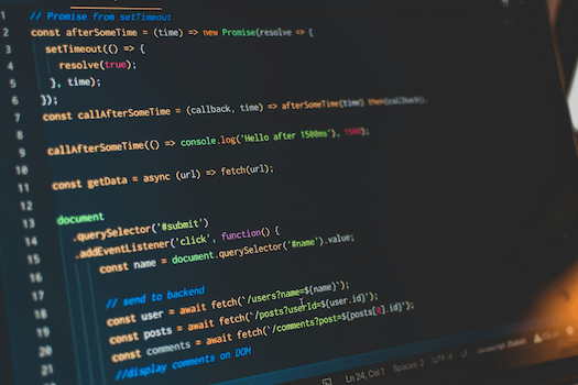 Vanilla JavaScript code performing DOM manipulation on laptop computer
